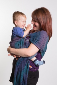 Mum with clapping toddler in a ring sling