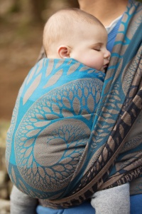 Entwistle Reservoir - Close up of a baby asleep in a Baie Slings wrap tied in a wrap cross carry