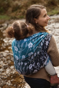 Entwistle Reservoir - picture of a mum carrying her toddler on her back in a Baie Slings carrier next to a stream