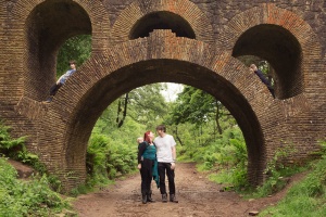 Blackburn child photographer - Family standing under and around a bridge